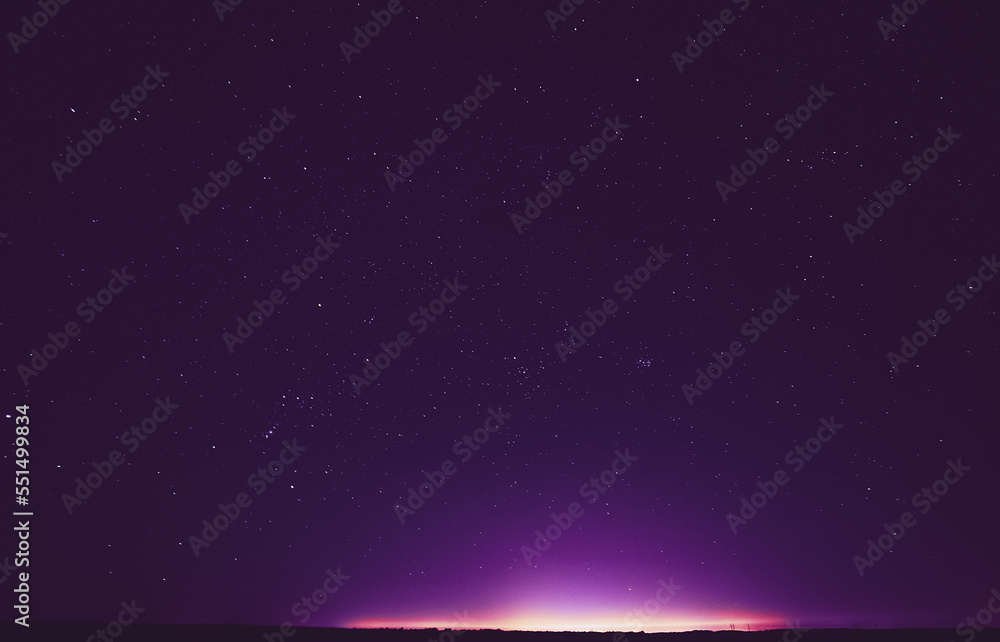 Obraz premium Colourful Night Starry Sky In Violet Colors. Soft Magenta-pink Colours. Bright Night Starry Sky. Dream View. Amazing Night View Sky. Bright Purple, Yellow, Pink Colors.