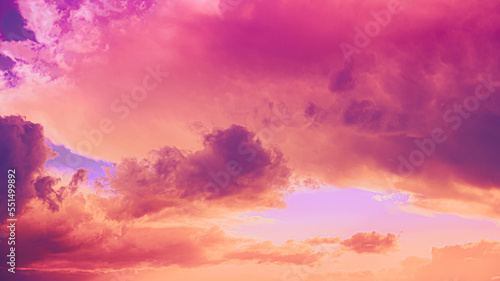 Fantasy Clouds. Gently Yellow, Orange, Pink, Red Colors. Amazing Color Effect Of Cloud. Natural Bright Dramatic Sky Background. Soft Colors. Sunrise Sky Natural Background.