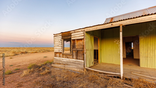 End of day landscape in McKinlay with abandoned buildings, Queensland, Australia