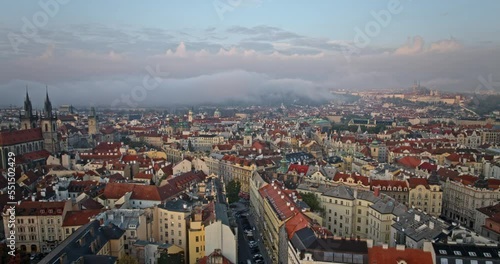 Prague Czechia Aerial v40 hyperlapse birds eye view flyover old town square capturing downtown cityscape with dramatic morning glory cloud motion in the sky - Shot with Mavic 3 Cine - October 2022 photo