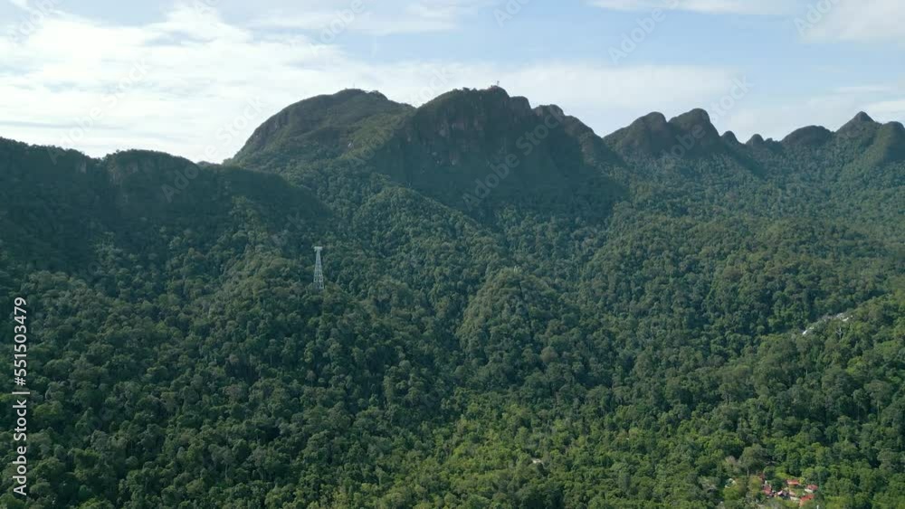 Aerial drone shot of green mountain peak with dense jungle in Langkawi Malaysia Aerial drone shot of green mountain peak with dense jungle in Langkawi Malaysia