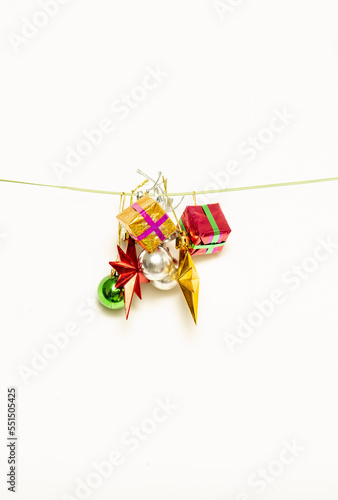 Christmas gifts are hanging on isolated white background