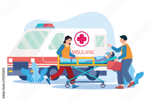 Medical Assistant Transferring The Patient Into An Ambulance