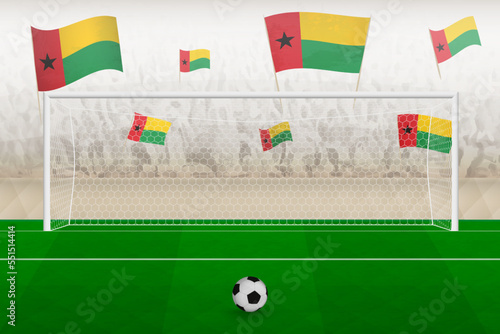 Guinea-Bissau football team fans with flags of Guinea-Bissau cheering on stadium, penalty kick concept in a soccer match.