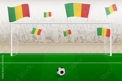 Mali football team fans with flags of Mali cheering on stadium, penalty kick concept in a soccer match.