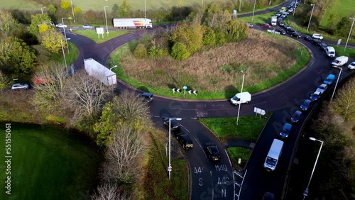 Traffic rush hour coming off roundabout . photo