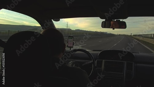 Wallpaper Mural Man driving on highway at sunset. View from inside the car Torontodigital.ca