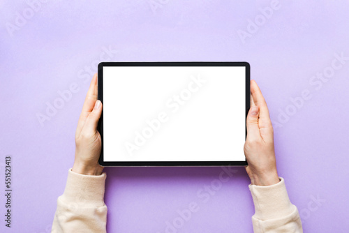 female teen hands using tablet pc with white screen, Mockup image of woman hand holding white tablet pc with blank white screen at home