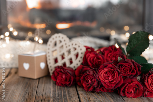 Festive background for Valentine's Day with a bouquet of red roses, copy space.