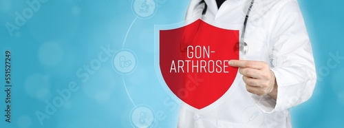 Gonarthrose (Kniearthrose). Arzt hält rotes Schutzschild umgeben von Icons im Kreis. Medizinisches Wort im Symbol