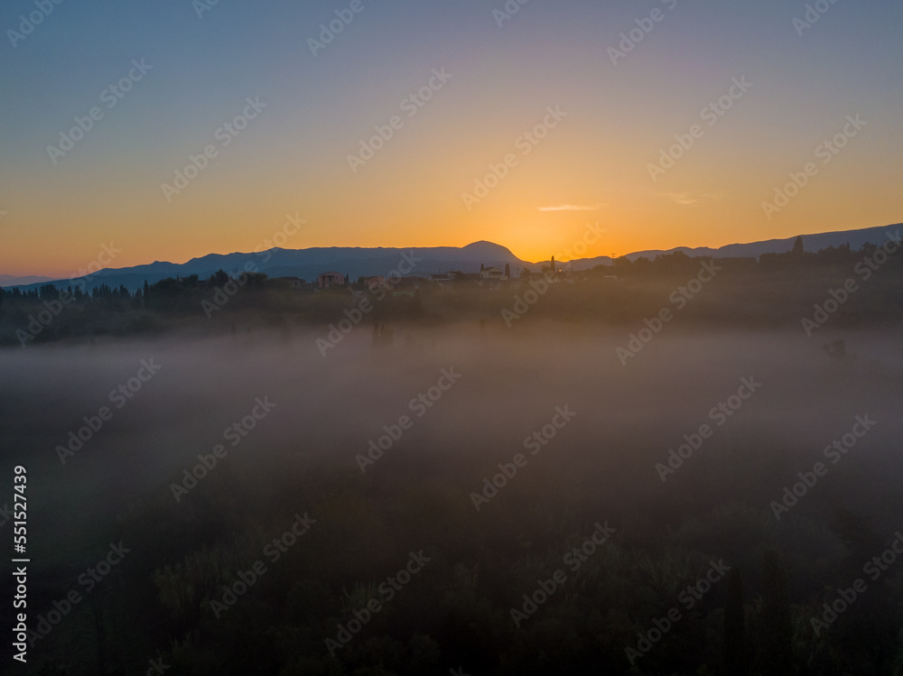 Beautiful drone view of sunrise north Corfu under the Mist