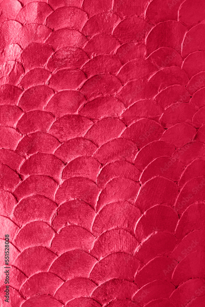 Close up pattern of mermaid or fish scales tiles toned in trendy color of the 2023 year Viva Magenta