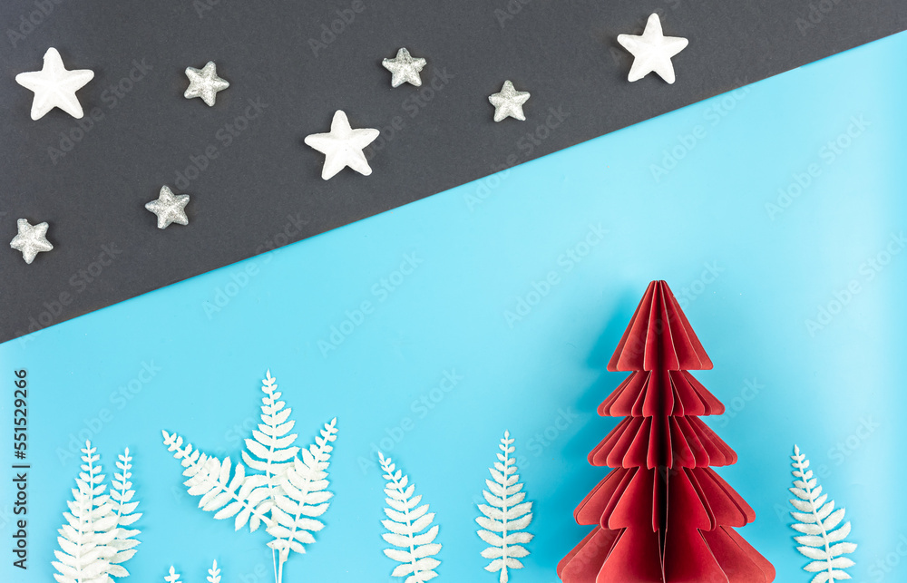 Obraz premium Christmas background with origami paper tree on paper background, flat lay.