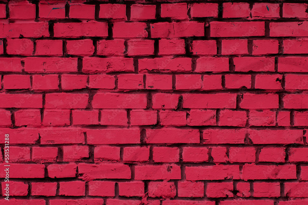 Fototapeta premium Brick wall toned in trendy color of the 2023 Viva Magenta