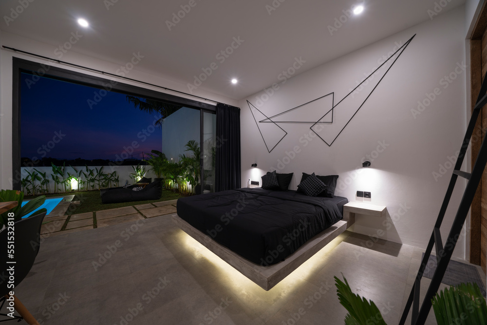 modern stone pine bed with red led lighting, wall lamps. Bedroom in luxury  loft apartment - shot in low light to highlight the atmosphere of red led  lights Photos | Adobe Stock