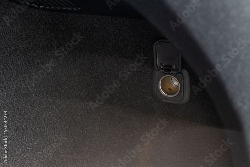 Foto Modern car outlet socket. Opened 12V power outlet socket.