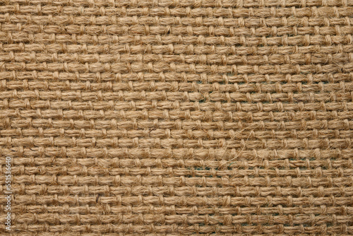 Texture of brown burlap  rough fabric with fibers for bags  macro