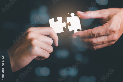 Photography Businessman holding a puzzle piece to find a business solution,