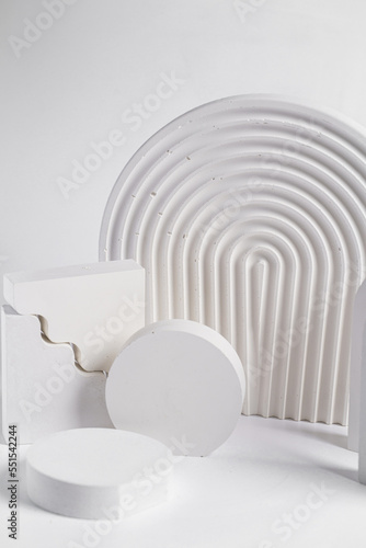 Fototapeta Naklejka Na Ścianę i Meble -  White props for product photography on white seamless background - half-circles, oval doors, rippled arch, zig-zag stairs
