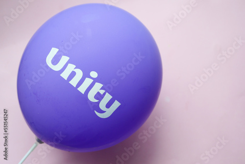 unity text on a purple color ballon,
