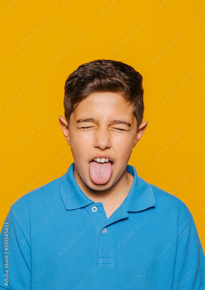 Funny boy with closed eyes and sticking out tongue Funny boy with closed eyes and sticking out tongue
