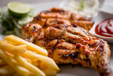 grilled chicken with french fries served in dish isolated on grey background top view of arabic food