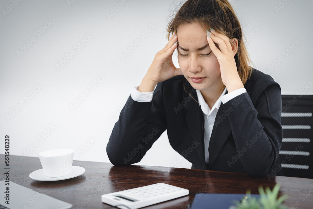 stressed girl Feeling headaches due to computer overwork or sedentary lifestyle Employees who are tired of working in the office, Office Syndrome. stressed girl Feeling headaches due to computer overwork or sedentary lifestyle Employees who are tired of working in the office, Office Syndrome.