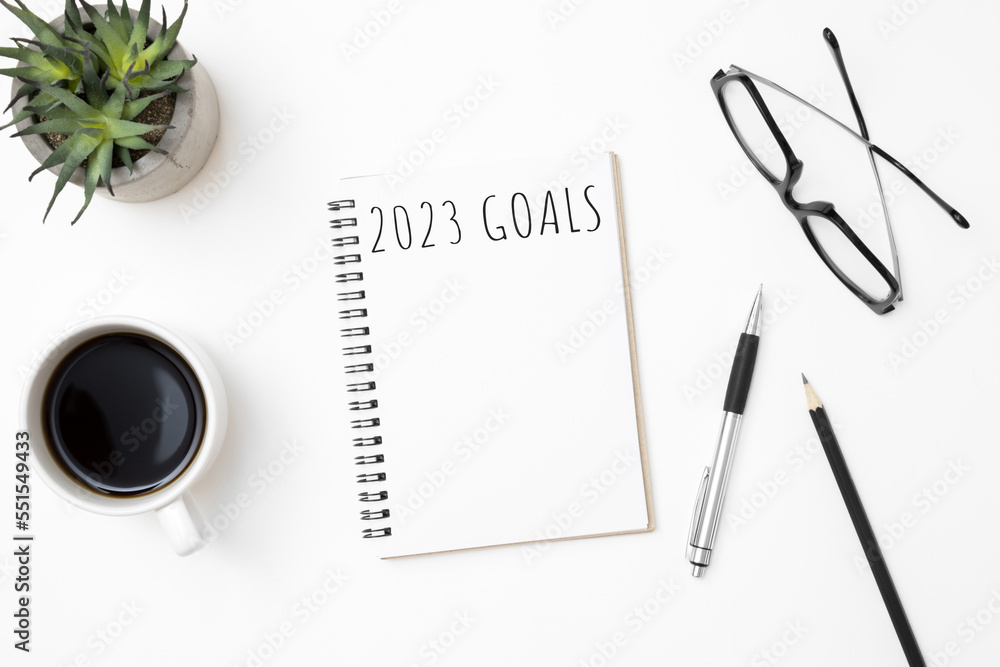 Notebook with 2023 goals text on it to apply new year resolutions and plan. Notebook with 2023 goals text on it to apply new year resolutions and plan.