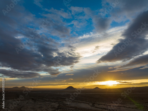 Radiant Sunrise Blanketing the Mojave Desert in Warmth and Wonder