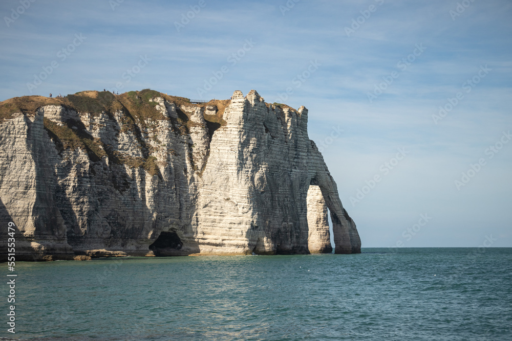 The cliffs of Etretat from the sandy beach of Etretat at high tide