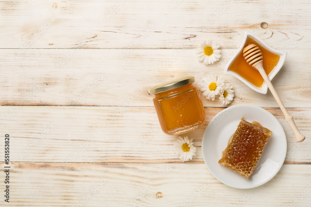 Composition with fresh honey on wooden background, top view Composition with fresh honey on wooden background, top view
