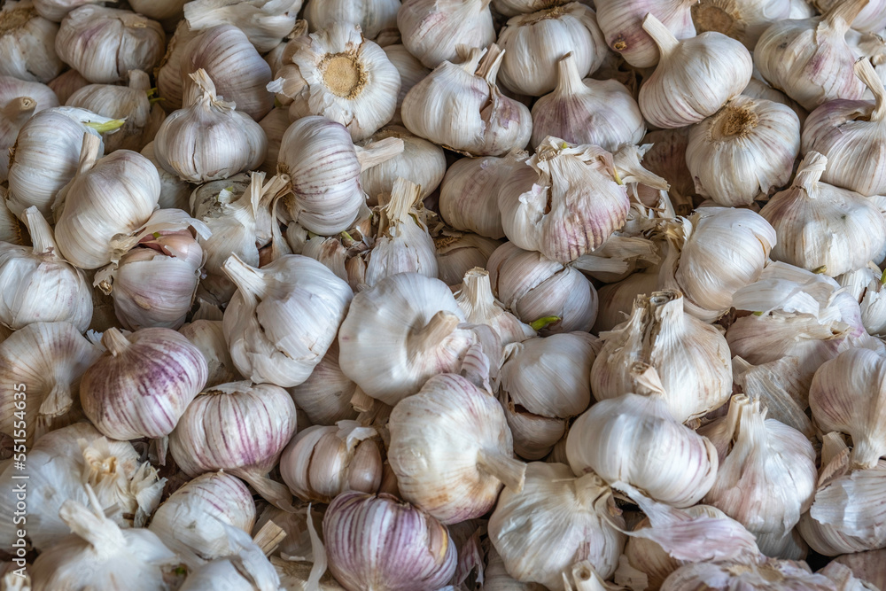 Fresh garlic in the market. Food background. Fresh garlic in the market. Food background.