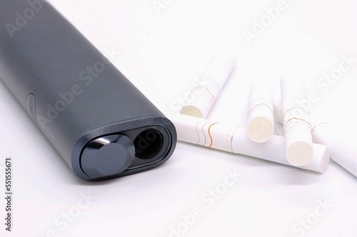 Not burning modern electronic cigarette heater with tobacco sticks on white background. Device of electronic cigarette for using tobacco sticks