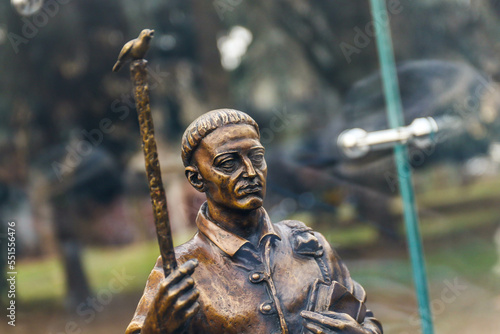 POLTAVA, UKRAINE - DECEMBER 3, 2022: Bronze sculpture of Ukrainian philosopher and poet Hryhorii Skovoroda during the day photo