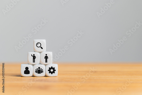 Fotografija White blocks with Human resource management icon on the wood table