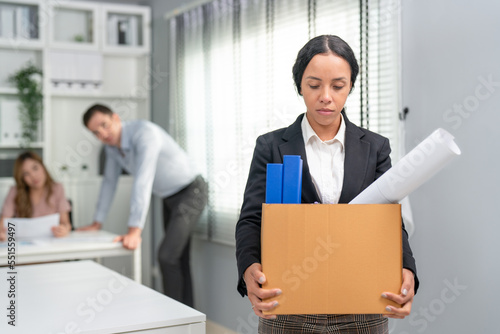 Εκτύπωση καμβά Woman office worker feel sad carrying cardboard boxes walking from office after resign, being fired or having employment contract expires