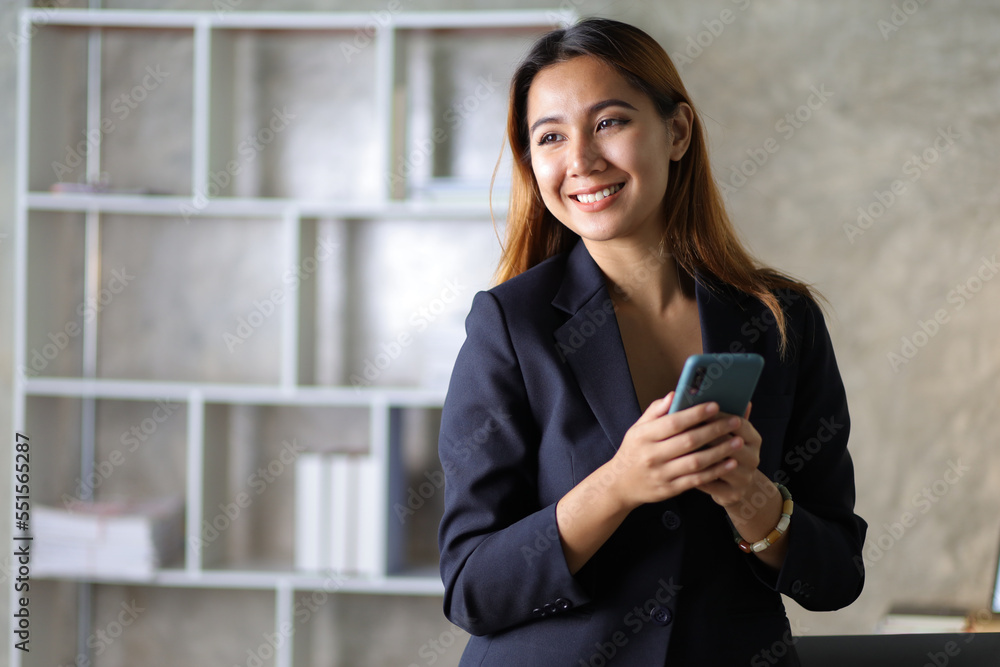 Portrait of charming businesswoman in office happy and drinking hot coffee.