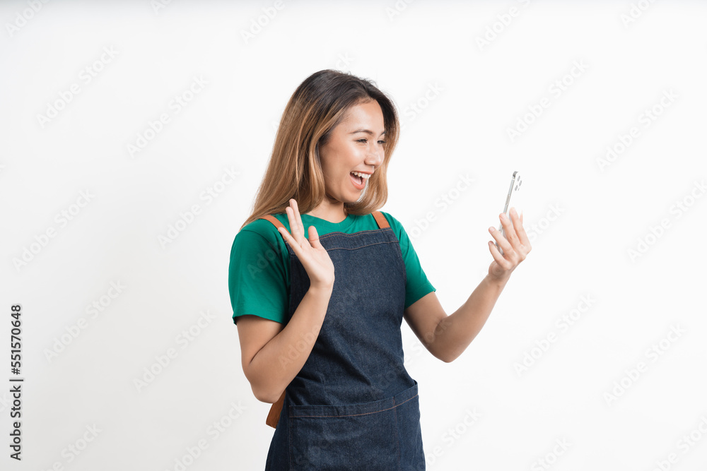 Young Asian business owners are excited by the good news while playing on their mobile phones isolate on white background, clipping path. Young Asian business owners are excited by the good news while playing on their mobile phones isolate on white background, clipping path.