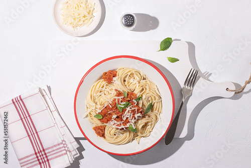 Bolognese pasta with sauce on table photo