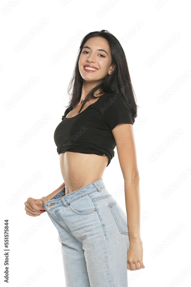 Weight loss happy woman isolated on a white background. Slim Body Weight loss happy woman isolated on a white background. Slim Body