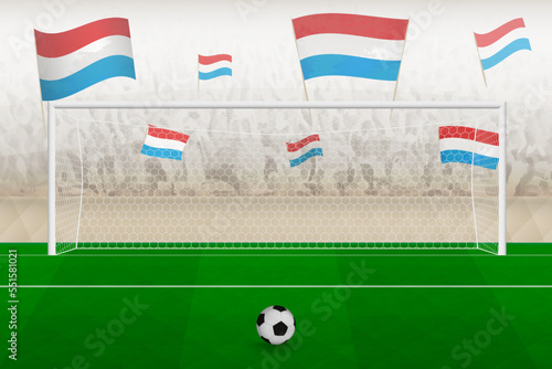 Luxembourg football team fans with flags of Luxembourg cheering on stadium, penalty kick concept in a soccer match.
