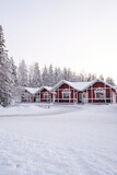 Red Christmas houses in the snow in Lapland