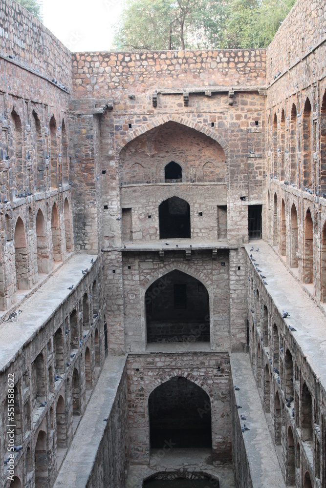 Delhi, India - June 2, 2004: Agrasen ki Baoli is also known as Agar Sain ki Baoli is a protected monument and consisting of 103 steps and built by Maharaja Agrasen in the Mahabharat era.
