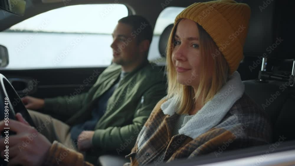 a woman driver driving with her husband on a forest road to the coastal line laughs and talks a woman driver driving with her husband on a forest road to the coastal line laughs and talks