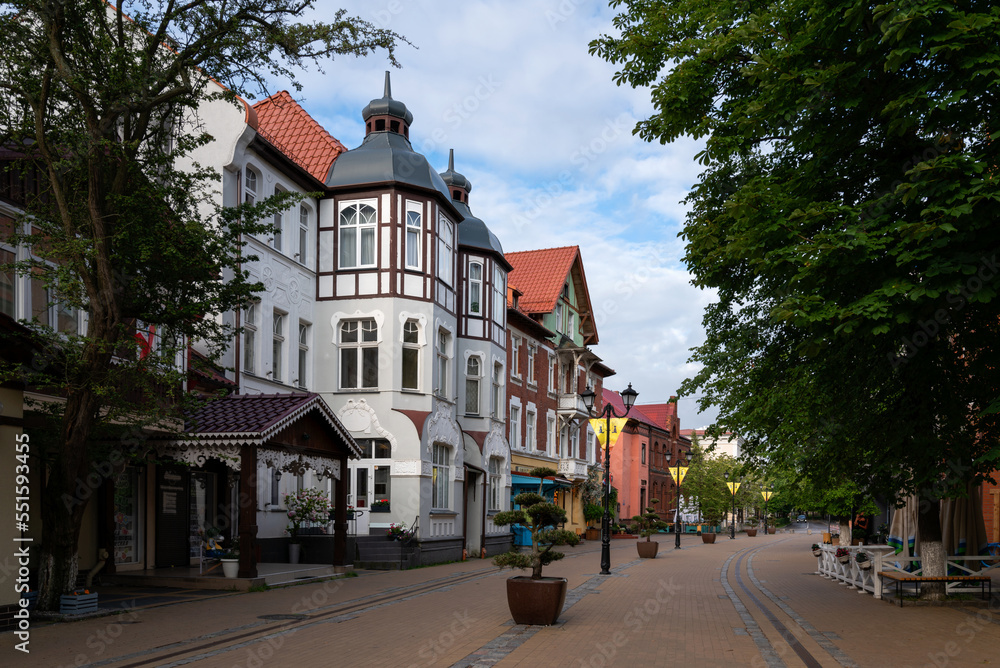 Obraz premium View of the tourist street in the historical center of the Baltic sea resort Zelenogradsk - Kurortny Prospekt on a summer morning, Kaliningrad region, Russia