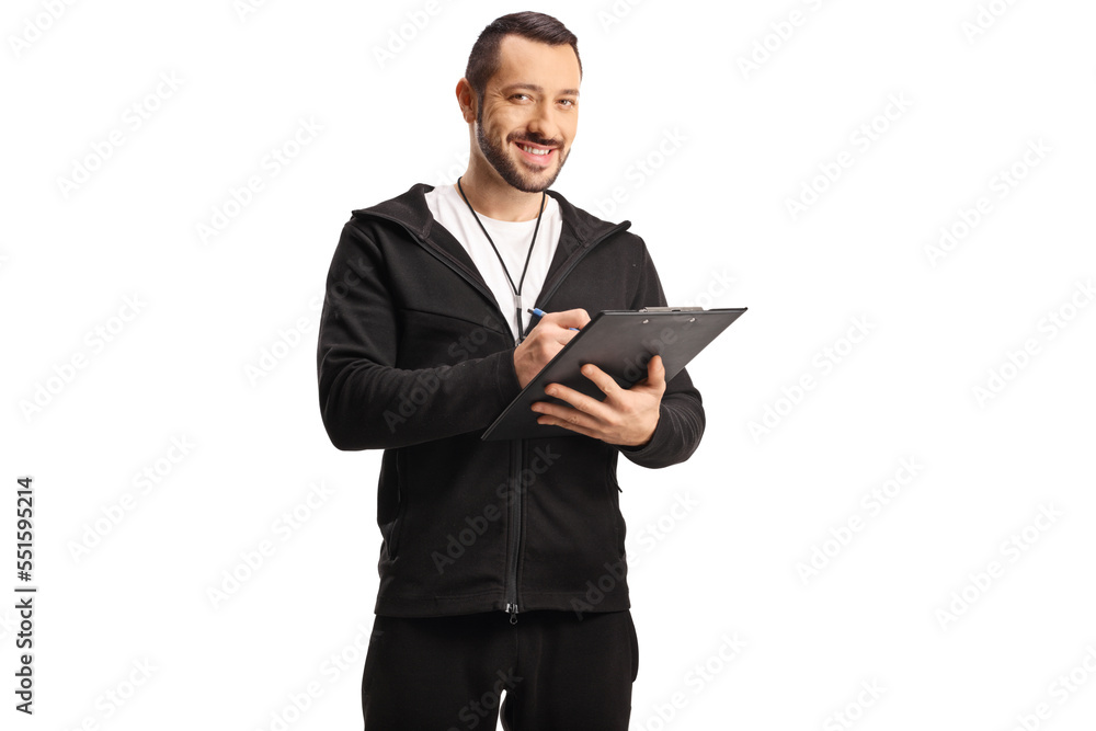 Sports coach with a whistle holding a clipboard and smiling Sports coach with a whistle holding a clipboard and smiling