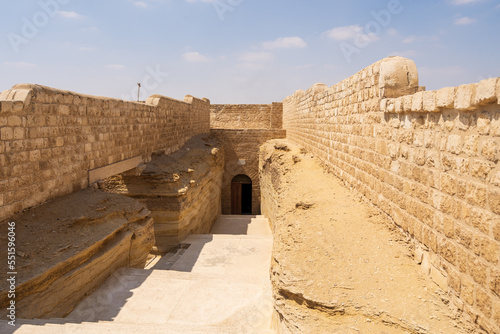 Fotografie The entrance to the Serapeum, the ancient Egyptian burial place for sacred bulls (Apis) with the large sarcophagi for the mummified bulls in Saqqara, Egypt
