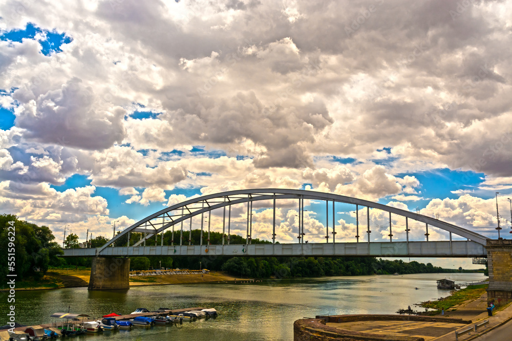 Naklejka premium Tisza river bridge and clouds in Szeged