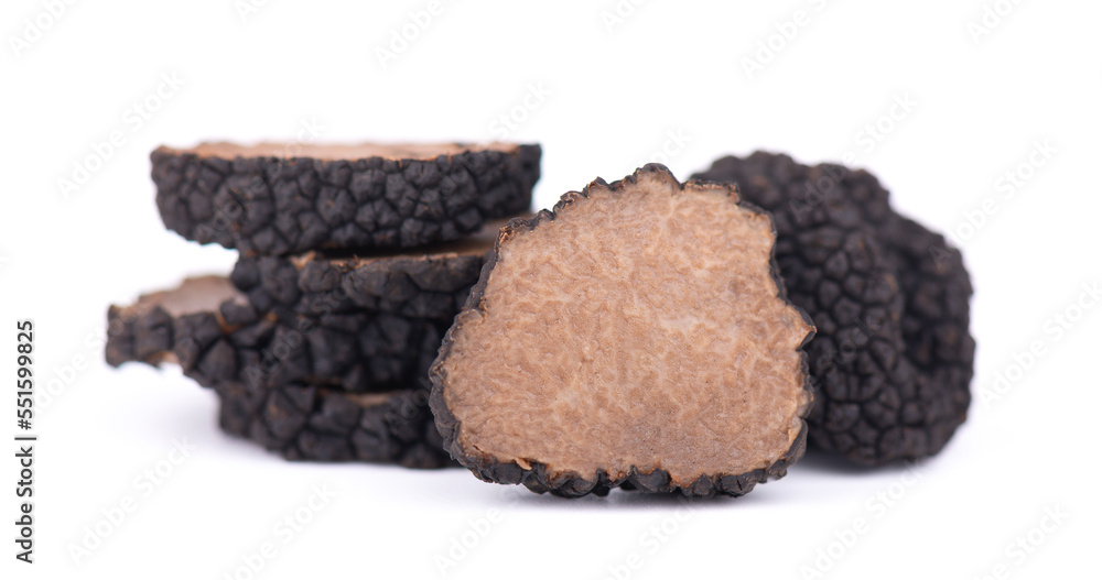 Black truffles isolated on a white background. Fresh sliced truffle. Delicacy exclusive truffle mushroom. Piquant and fragrant French delicacy. Clipping path.
