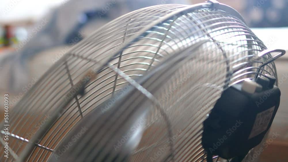 4k Electric air fan turning off. Close up of hand switching off an air